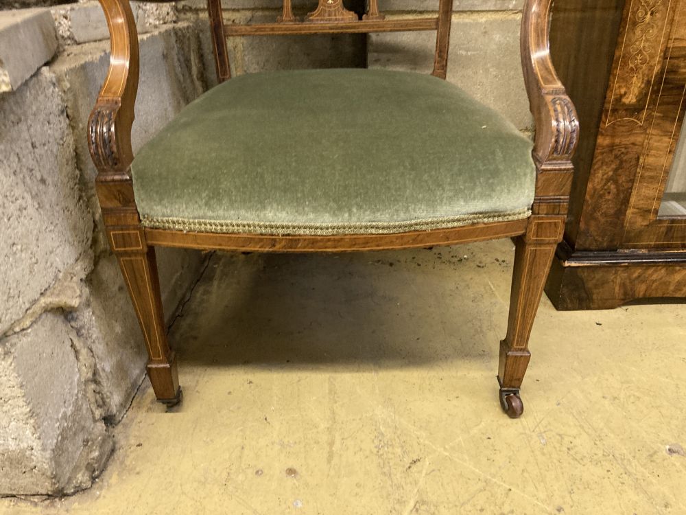 An Edwardian bone and marquetry-inlaid rosewood elbow chair, on square tapered legs with castors, width 55cm, height 89cm